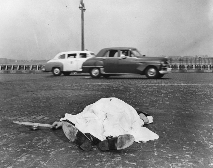 The Victim of a Motor Accident Lies by the Side of the West Side Highway in New York, Covered by a Sheet