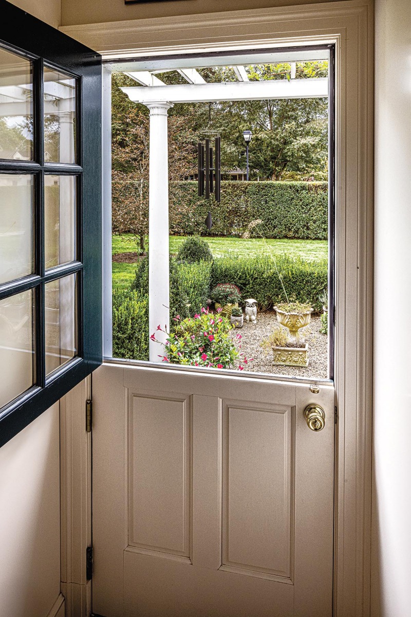 A charming Dutch door off the butler’s pantry leads to a small kitchen garden.